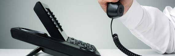 businessman on business landline telephone in an office concept